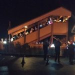 2018.12.11 Carol Train passengers from Bishops Lydeard line platform and bridge as the band plays from the car park. © Chris Hooper.