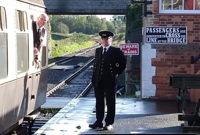2022.10.30 TTI Brian and PIC Peter smile as the down train pulls out of Williton on the last day of the timetable. © Chris Hooper